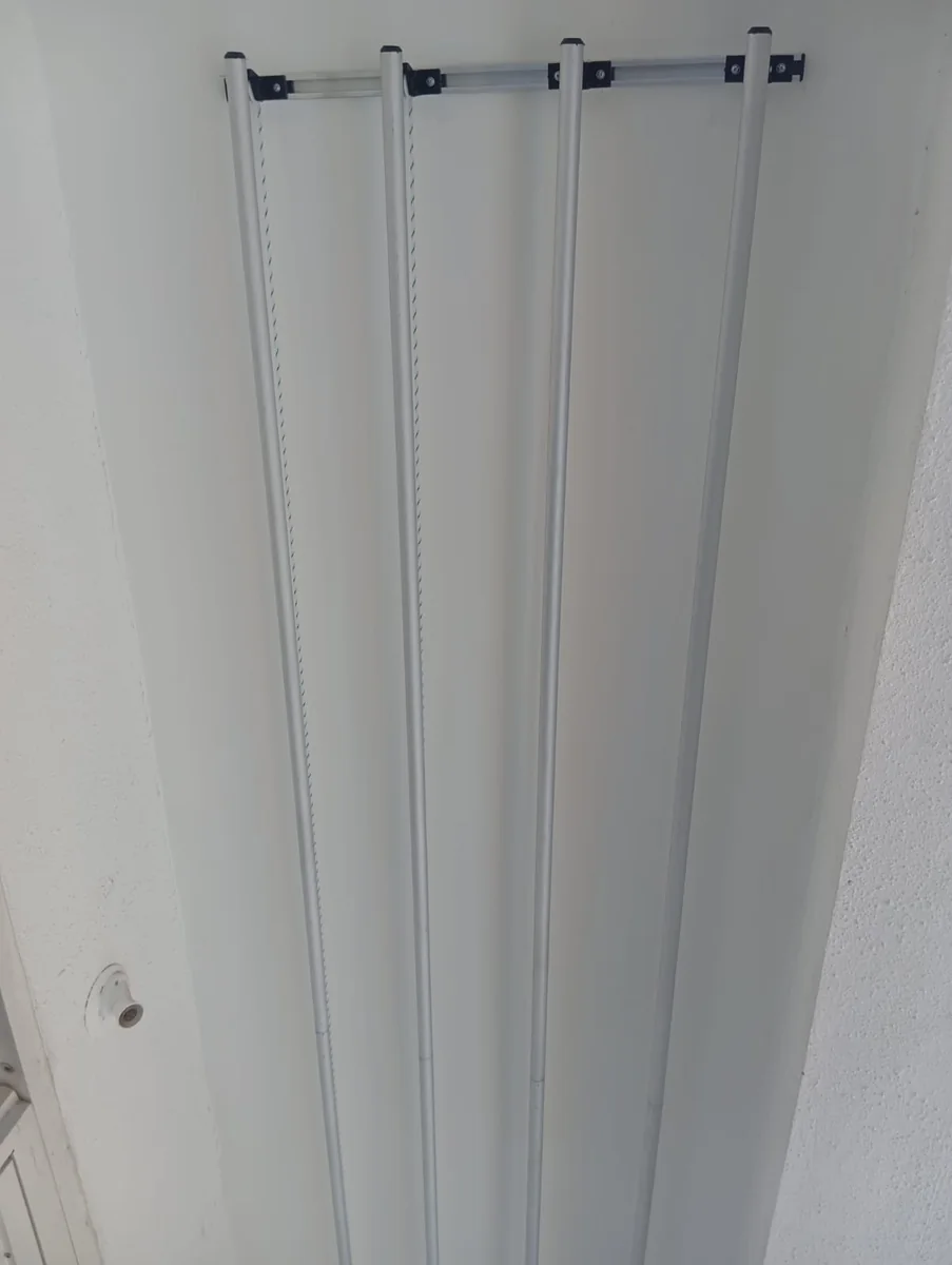Close-up of ceiling mounted aluminium hanger rods